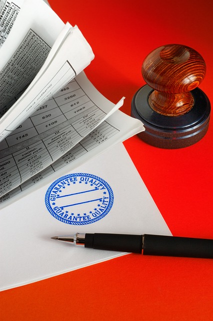 Work Permit An artistic display of a stamp, pen, and paper on a bold red background, highlighting elements of communication and creativity.